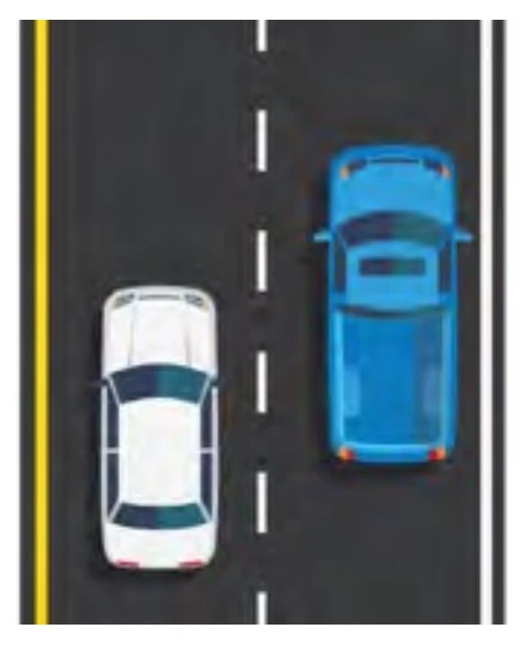 Multi-lane one-way road separated by a broken white line