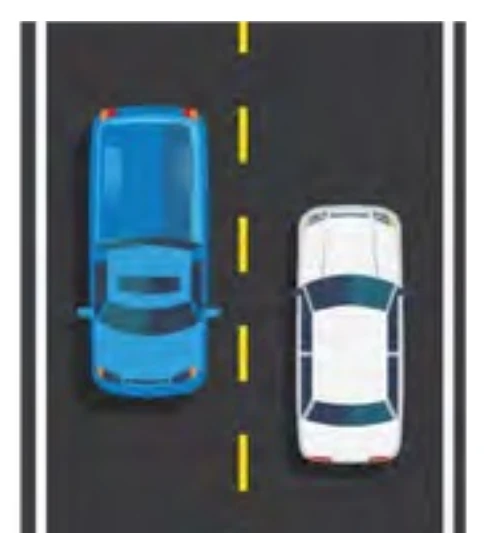 Two-lane road with a broken yellow center line