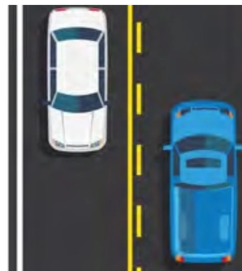 Road markings showing solid yellow line on the driver's side